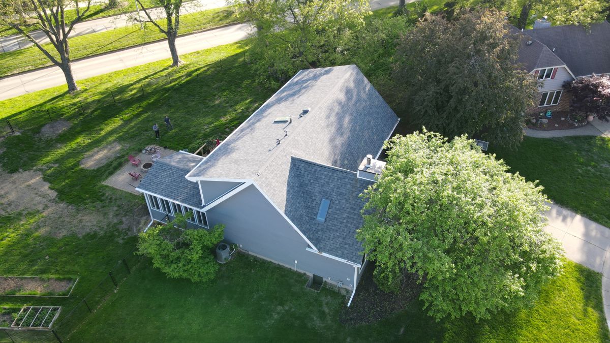 A house with a new asphalt shingle roof