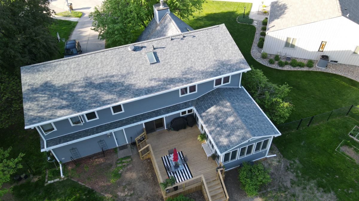 A residential home with a newly installed asphalt shingle roof