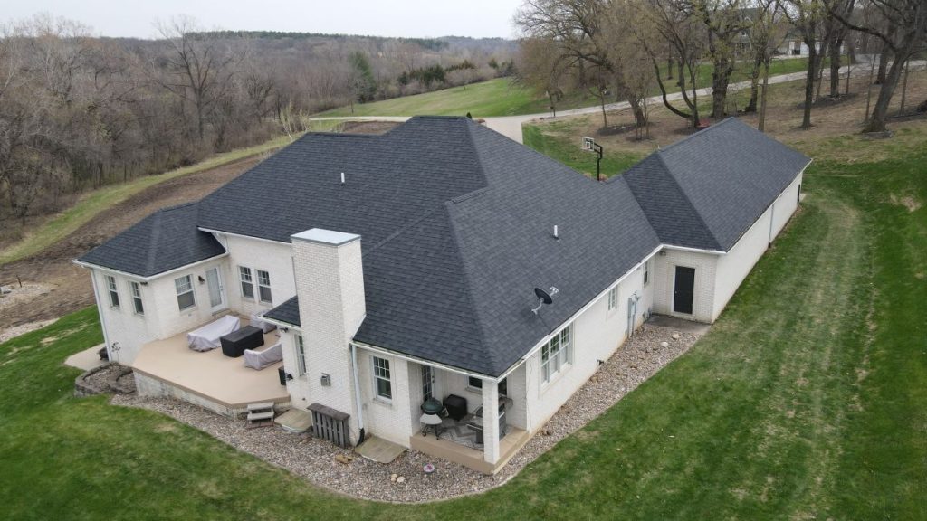 Large house with newly installed architectural shingles